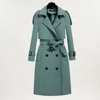 Les Odettes Ashly™ longline trench coat in beige, stylish lightweight outerwear with classic collar and belted waist.