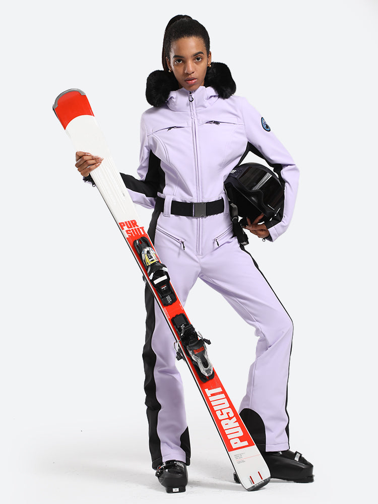 Les Odettes women's classic faux fur one-piece ski suit, insulated winter ski attire with hood and full-length zipper.