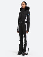 Les Odettes women's classic faux fur one-piece ski suit, featuring a stylish ski suit with faux fur accents for winter skiing.