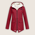 Les Odettes ThermaShell™ waterproof and windproof rain jacket, showing its sleek design and durable fabric for outdoor protection.