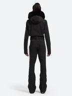Les Odettes women's classic faux fur one-piece ski suit, featuring a warm, stylish ski outfit with fur accents and a snug fit.