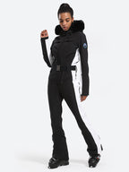 Les Odettes women's classic faux fur one-piece ski suit, featuring a stylish ski suit with fur lining and winter-ready design.