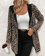 Aleah™ reversible leopard print coat by Les Odettes, shown with one side featuring a stylish leopard pattern and the other side in solid color.