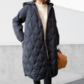 Les Odettes Nordica oversized hooded parka with detailed stitching and a plush hood, ideal for cold weather coats and jackets.