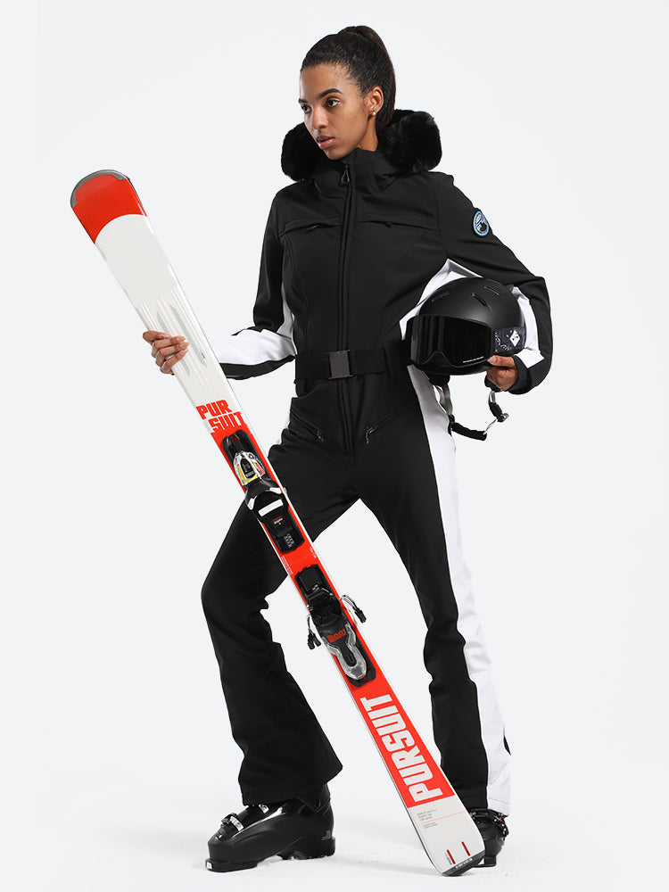 Les Odettes women's classic faux fur one-piece ski suit with hood, front zipper, and insulated design for winter skiing.
