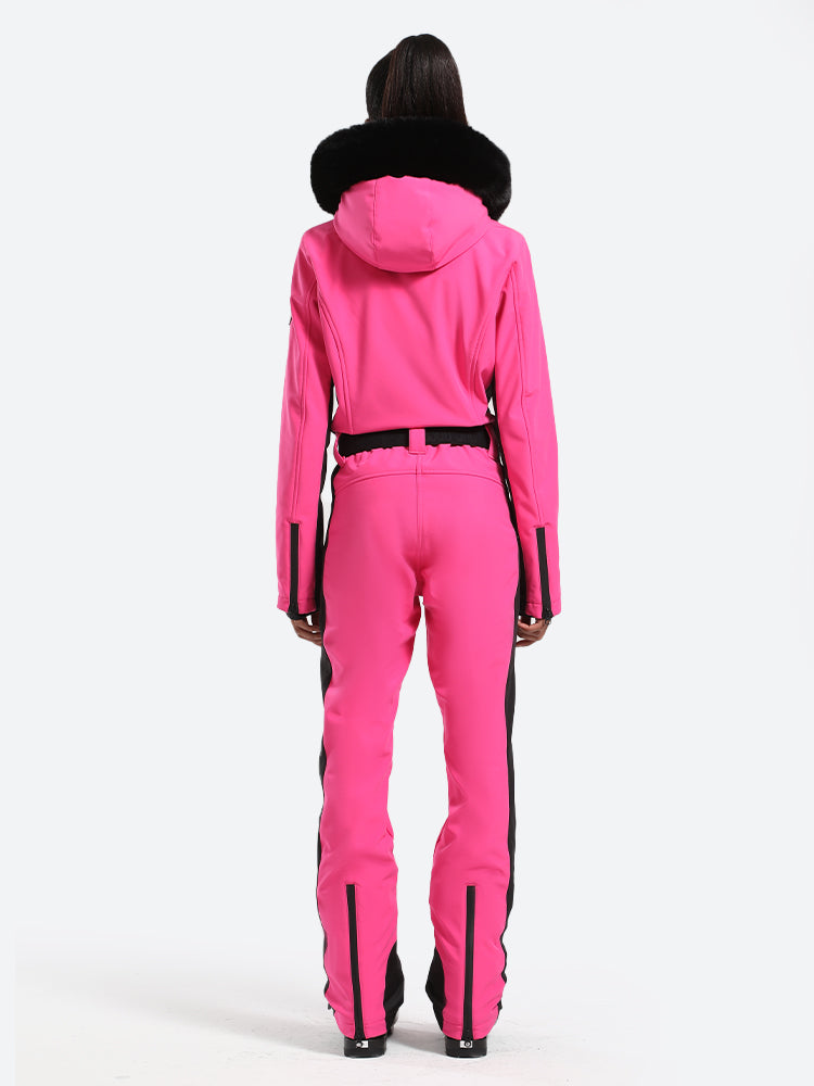 Les Odettes women's classic faux fur one-piece ski suit with hood, perfect for winter skiing in snowy conditions.