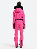 Les Odettes women's classic faux fur one-piece ski suit with hood, perfect for winter skiing in snowy conditions.