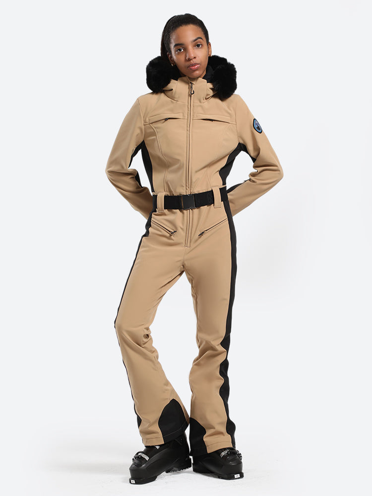 Les Odettes women's classic faux fur one-piece ski suit with hood, designed for winter skiing, in a stylish and warm outdoor setting.