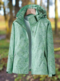 Les Odettes Leslie™ women’s waterproof summer veste, lightweight jacket with a hood, shown in a vibrant color.