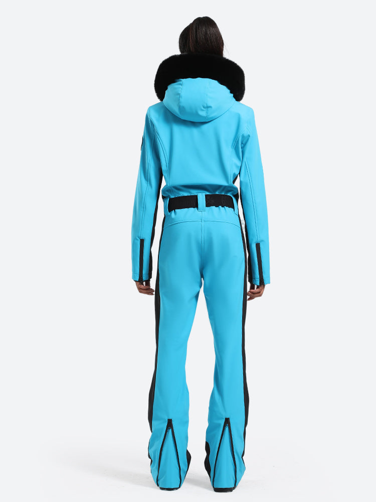 Les Odettes women's classic faux fur one-piece ski suit, featuring a stylish ski jacket and pants with fur trim and winter insulation.
