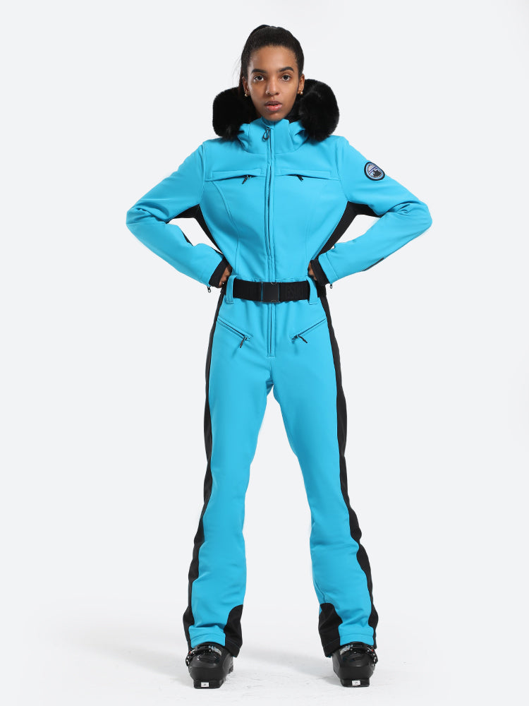 Les Odettes women's classic faux fur one-piece ski suit with hood, front zipper, and winter insulation, designed for skiing and snowboarding.