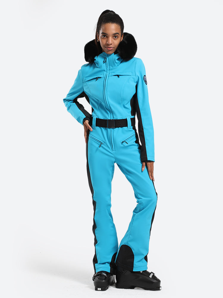 Les Odettes women's classic faux fur one-piece ski suit with hood, front zipper, and winter insulation for alpine skiing.