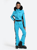 Les Odettes women's classic faux fur one-piece ski suit with hood, front zipper, and winter insulation for alpine skiing.