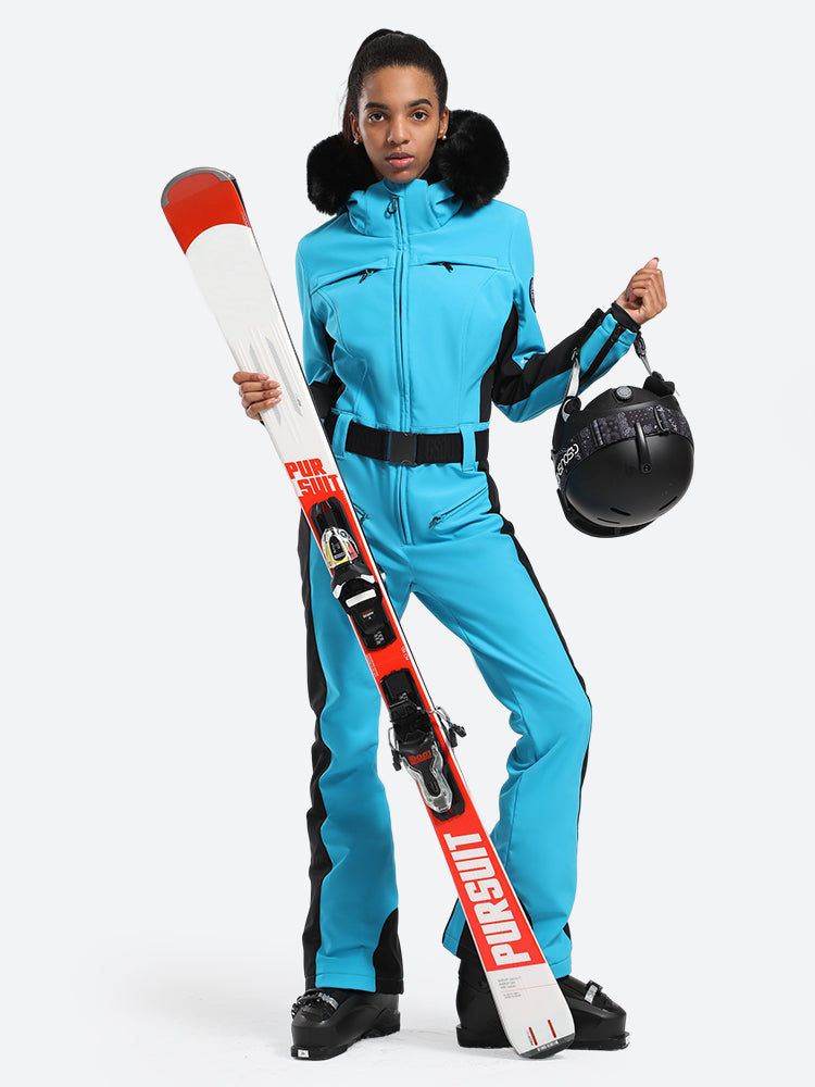 Les Odettes women's classic faux fur one-piece ski suit, black with faux fur collar, designed for winter skiing and cold weather.