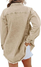 Les Odettes Gabriella™ denim jacket hanging on a clothing rack, showcasing classic blue denim with silver button details.