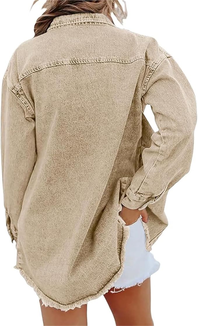 Les Odettes Gabriella™ denim jacket hanging on a clothing rack, showcasing classic blue denim with silver button details.