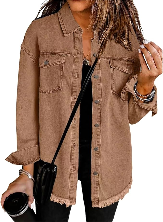 Les Odettes Gabriella™ denim jacket featuring classic blue denim with front pockets and button closure on a hanger.