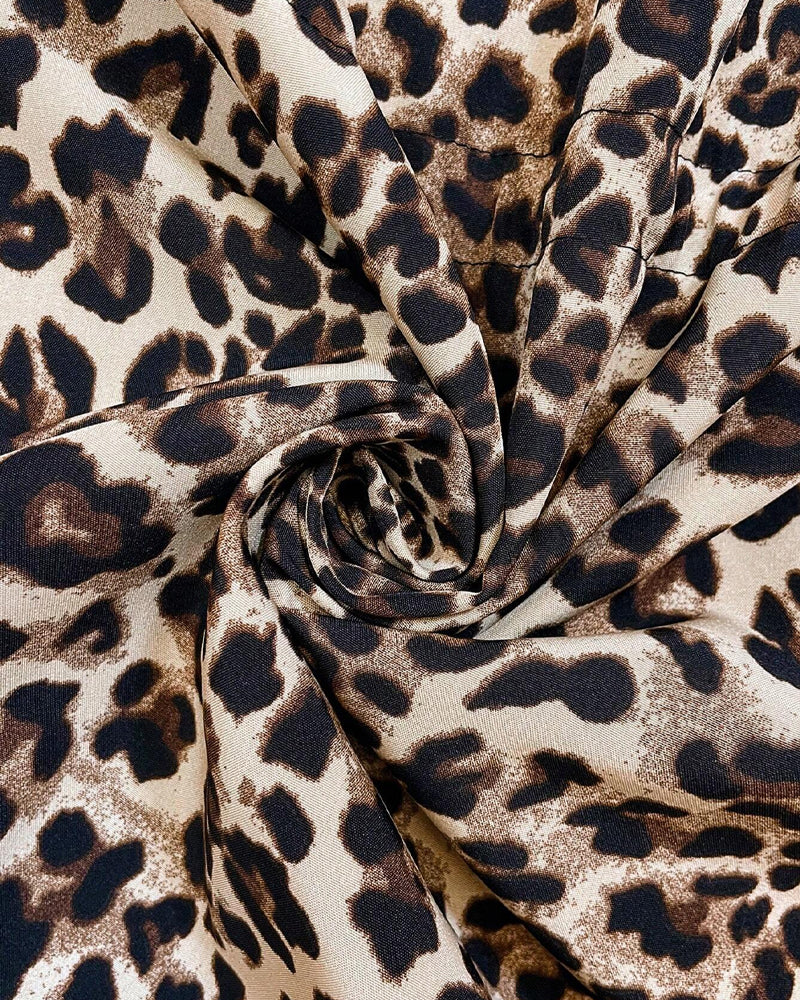 Aleah™ reversible coat by Les Odettes featuring stylish leopard print on one side and solid fabric on the other.
