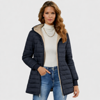 Geraldine Sherpa-lined winter coat by Les Odettes featuring plush interior, cozy hood, and stylish design for cold weather warmth.