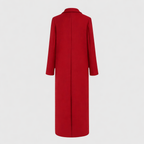 Les Odettes Sally™ longline winter trench coat draped on a hanger, showcasing its classic design and warm fabric.