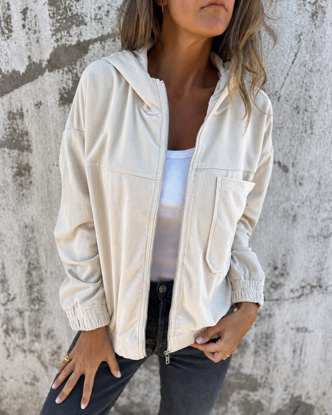 Les Odettes Cynthia™ hooded zip jacket in stylish fabric, featuring a front zipper and hood, perfect for casual wear.