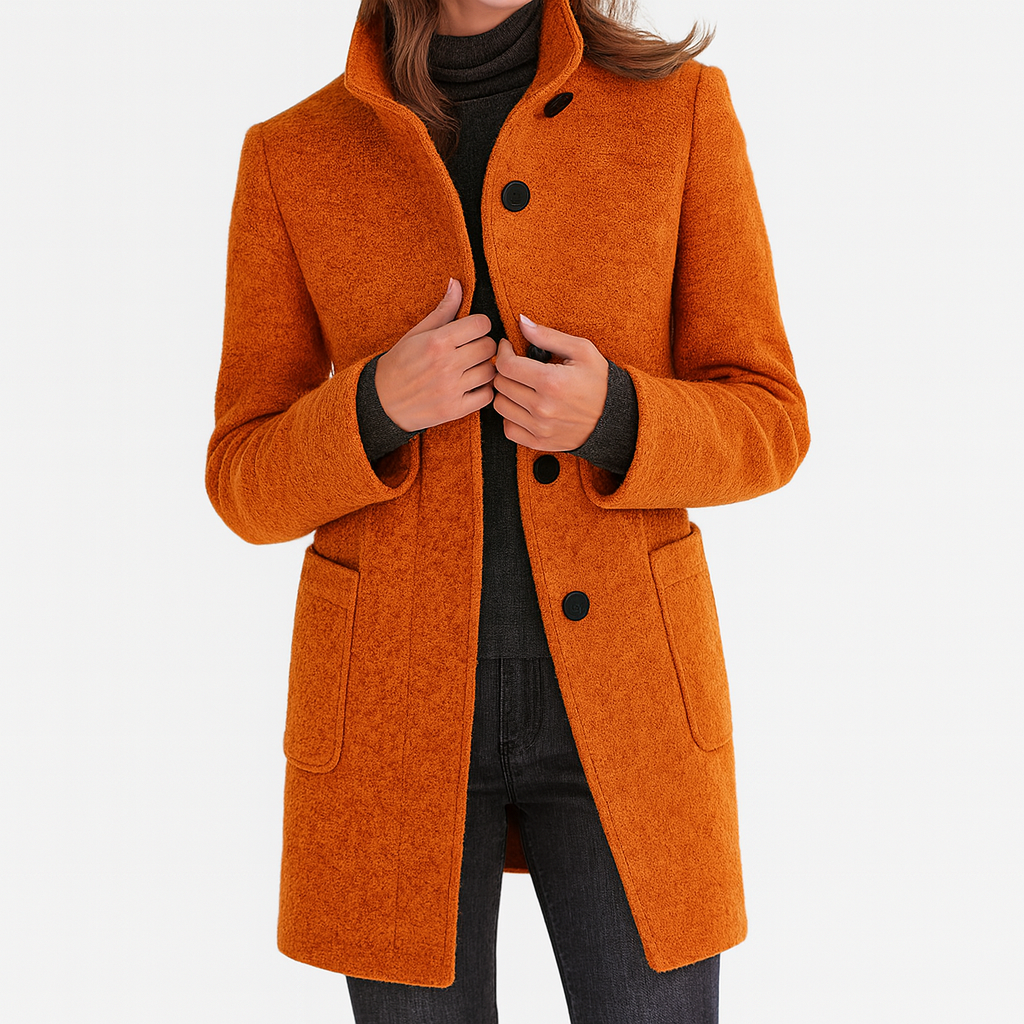 Les Odettes Camila™ timeless women's coat in neutral fabric, stylishly displayed on a hanger.