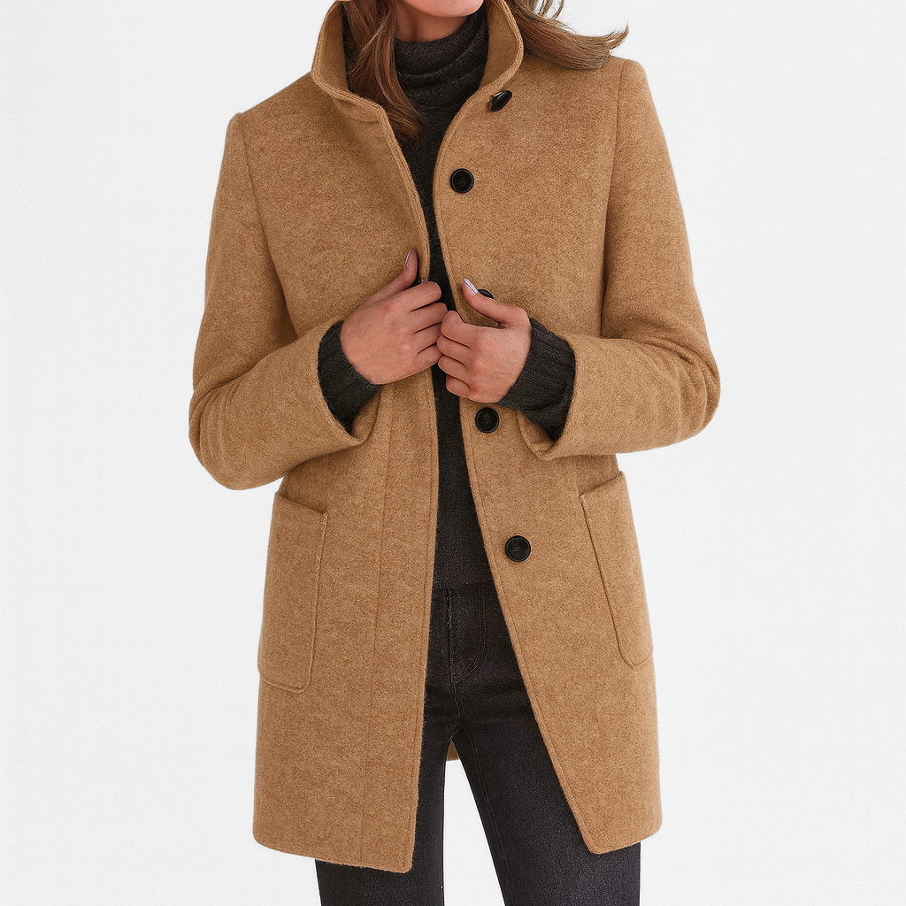 Les Odettes Camila™ women's coat featuring a classic tailored design in neutral fabric, displayed on a hanger.