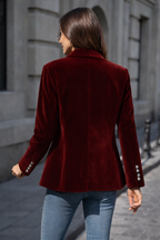 Elegant velvet blazer by Les Odettes, featuring a tailored fit and luxurious fabric, displayed on a hanger.
