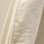 Les Odettes Celeste™ soft comfort vest displayed on a model, featuring a cozy, lightweight design in neutral tones.