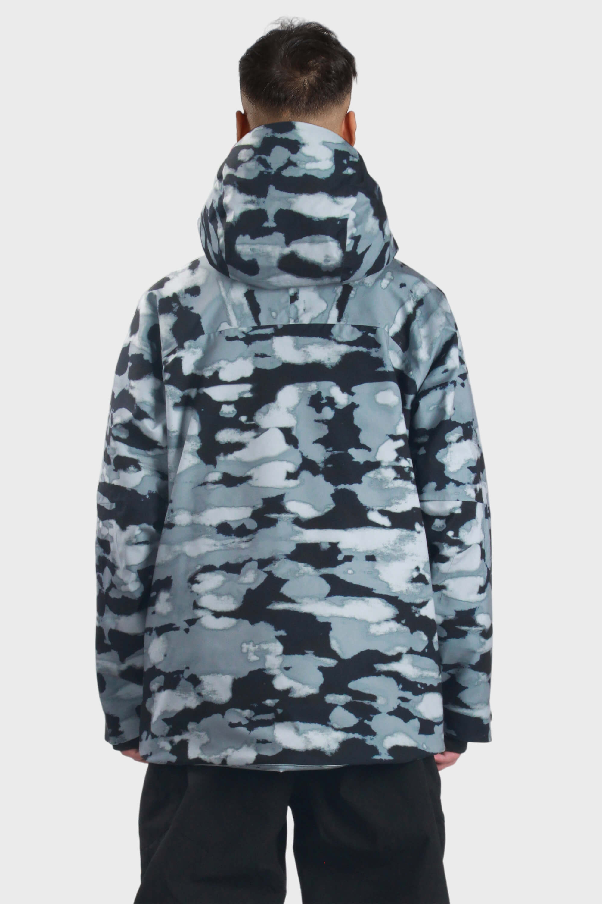 Men's camouflage snow jacket by Les Odettes with face vent, multiple pockets, and waterproof design for winter outdoor wear.