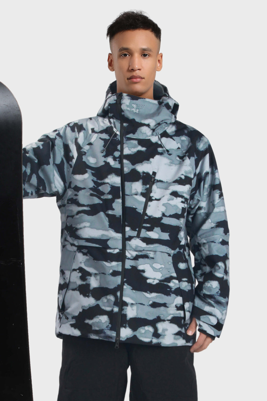 Men's camouflage snow jacket by Les Odettes with face venting, multiple pockets, and waterproof design for winter outdoor activities.