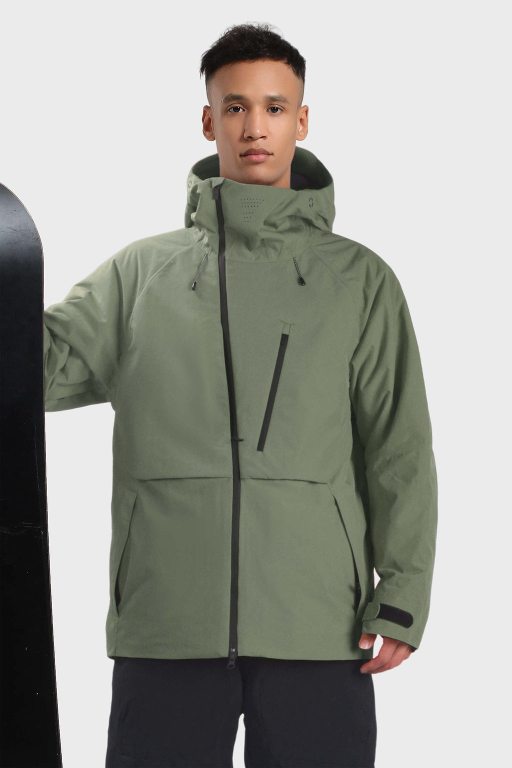Men's camouflage snow jacket by Les Odettes with face vent, multiple pockets, and waterproof design, shown with hood and zipper details.
