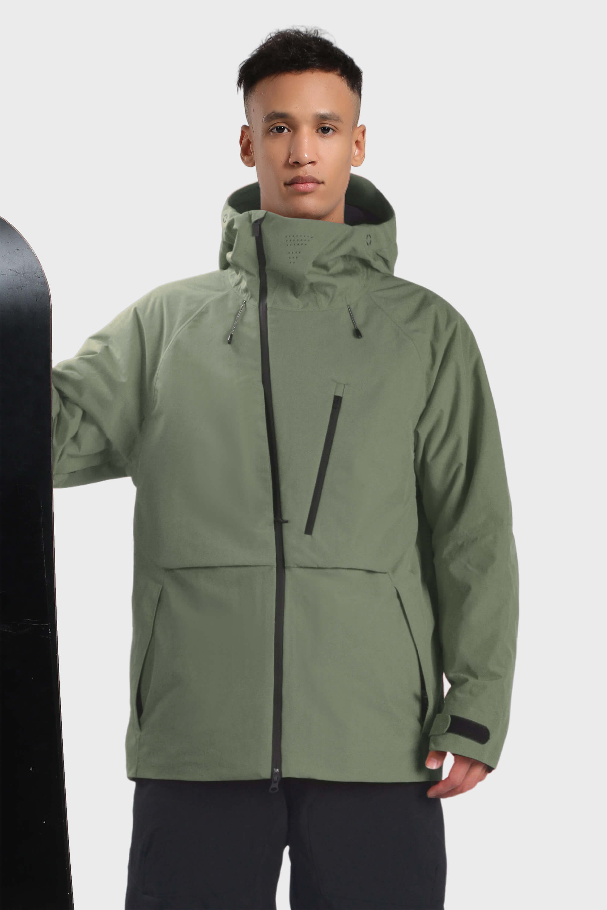 Men's camouflage snow jacket by Les Odettes with face vent, multiple pockets, and waterproof design, shown with hood and zipper details.