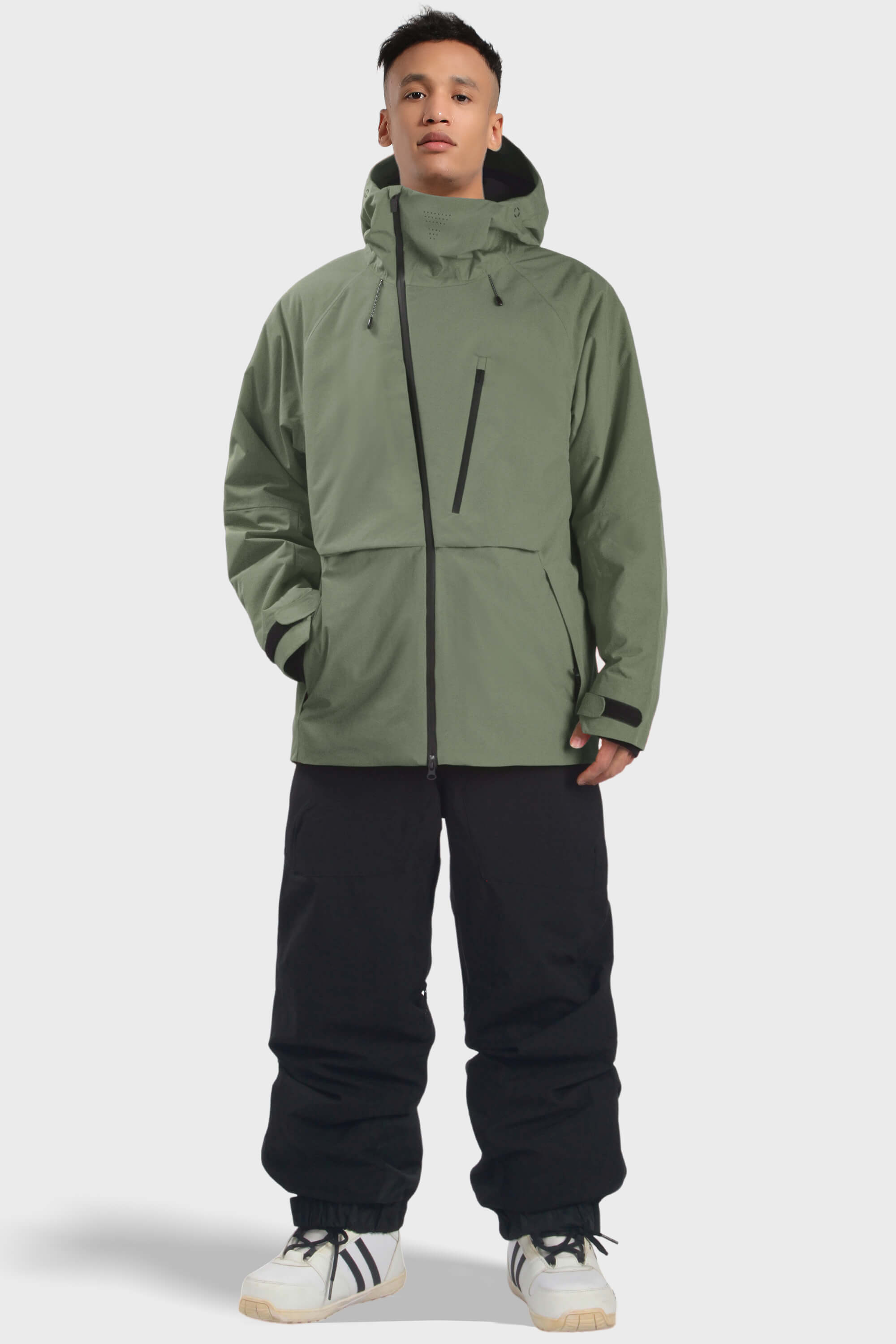 Men's camouflage snow jacket by Les Odettes, waterproof with face vent and multiple pockets, designed for winter outdoor activities.