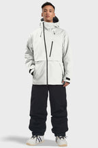 Men's camouflage waterproof snow jacket with face vent, multiple pockets, by Les Odettes, designed for winter outdoor activities.
