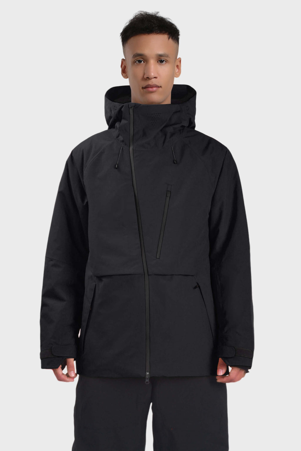 Men's camouflage snow jacket by Les Odettes with face vent, multiple pockets, fully waterproof, and snow-resistant features.