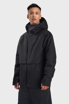 Men's camouflage snow jacket by Les Odettes with face venting, multi-pocket, and fully waterproof design for winter outdoor activities.