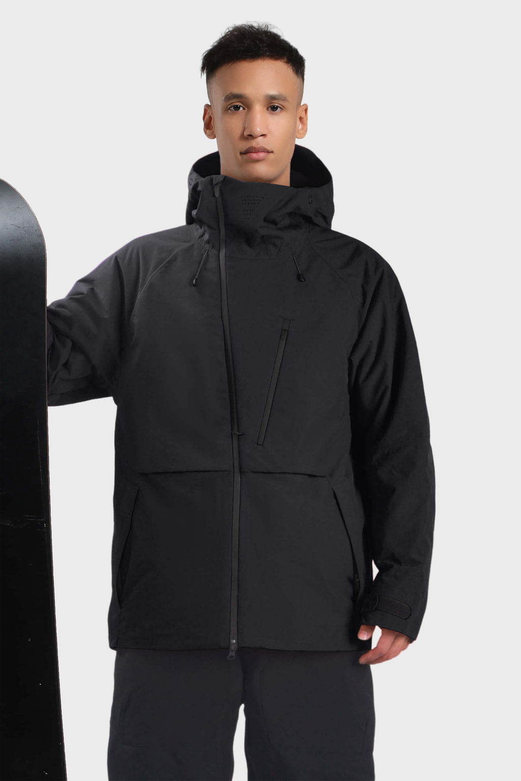Men's camouflage snow jacket by Les Odettes with face vent, multiple pockets, and waterproof design, shown in black color.