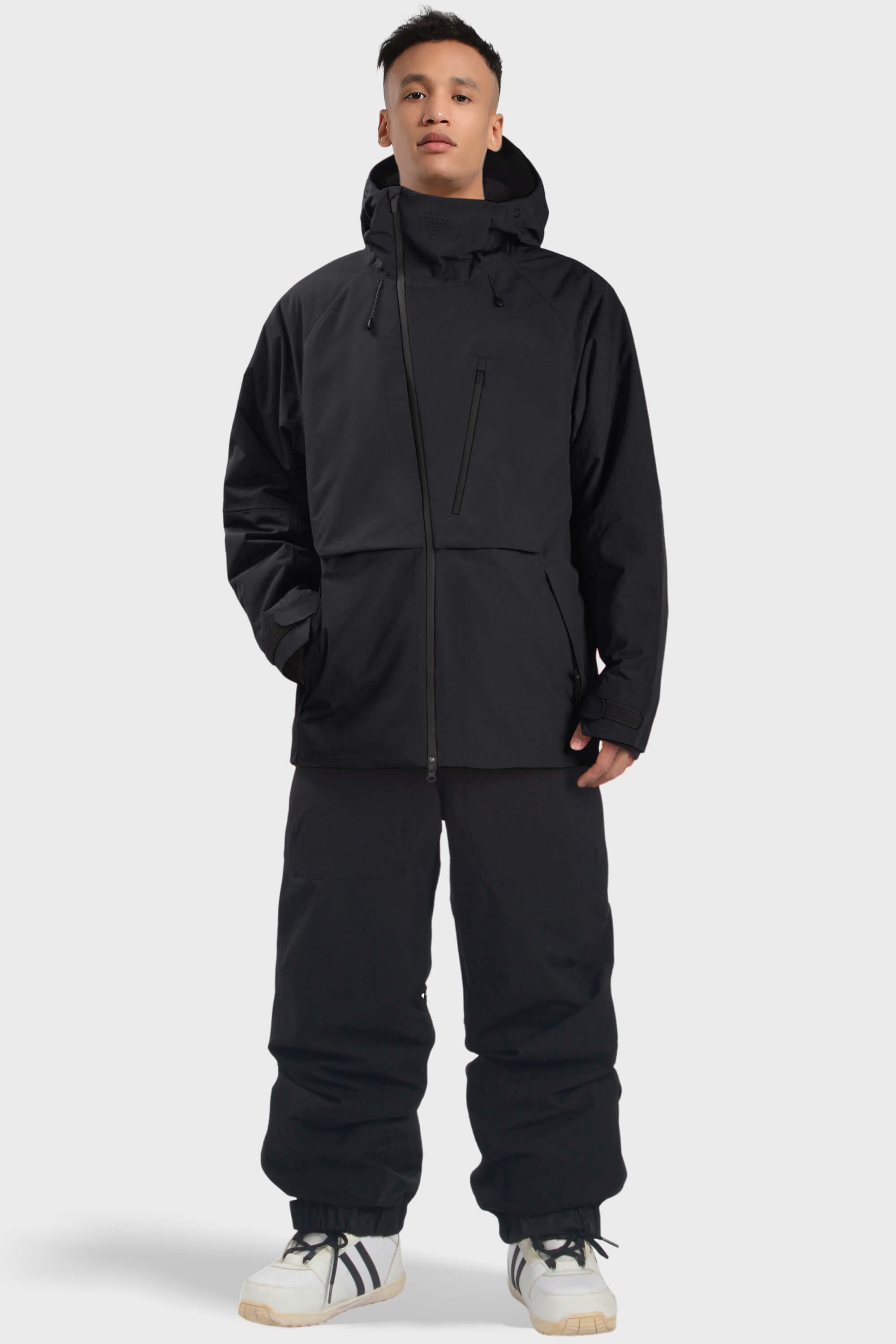 Men's camouflage face vented snow jacket by Les Odettes with multiple pockets and waterproof design, shown in black with vent details.