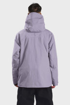Men's camouflage snow jacket by Les Odettes with face vent, multiple pockets, fully waterproof, designed for winter outdoor activities.