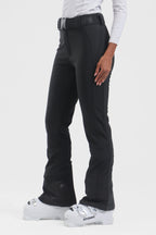 Black women's slim fit fleece-lined ski pants by Les Odettes, showing the snug fit and sleek winter-ready design.