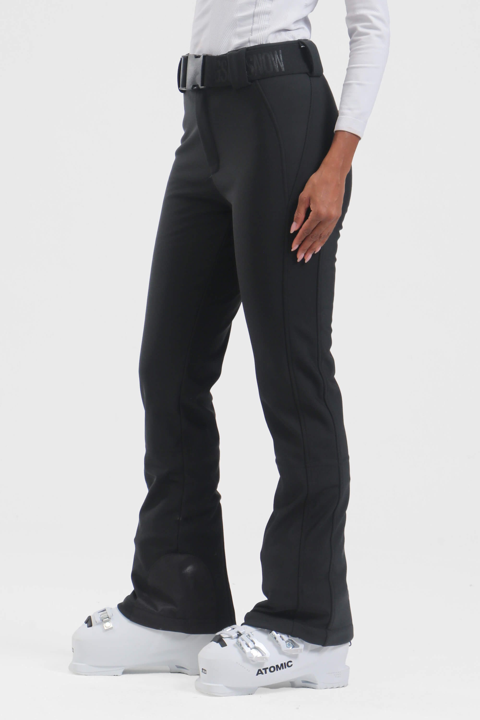 Black women's slim fit fleece-lined ski pants by Les Odettes, showing the snug fit and sleek winter-ready design.