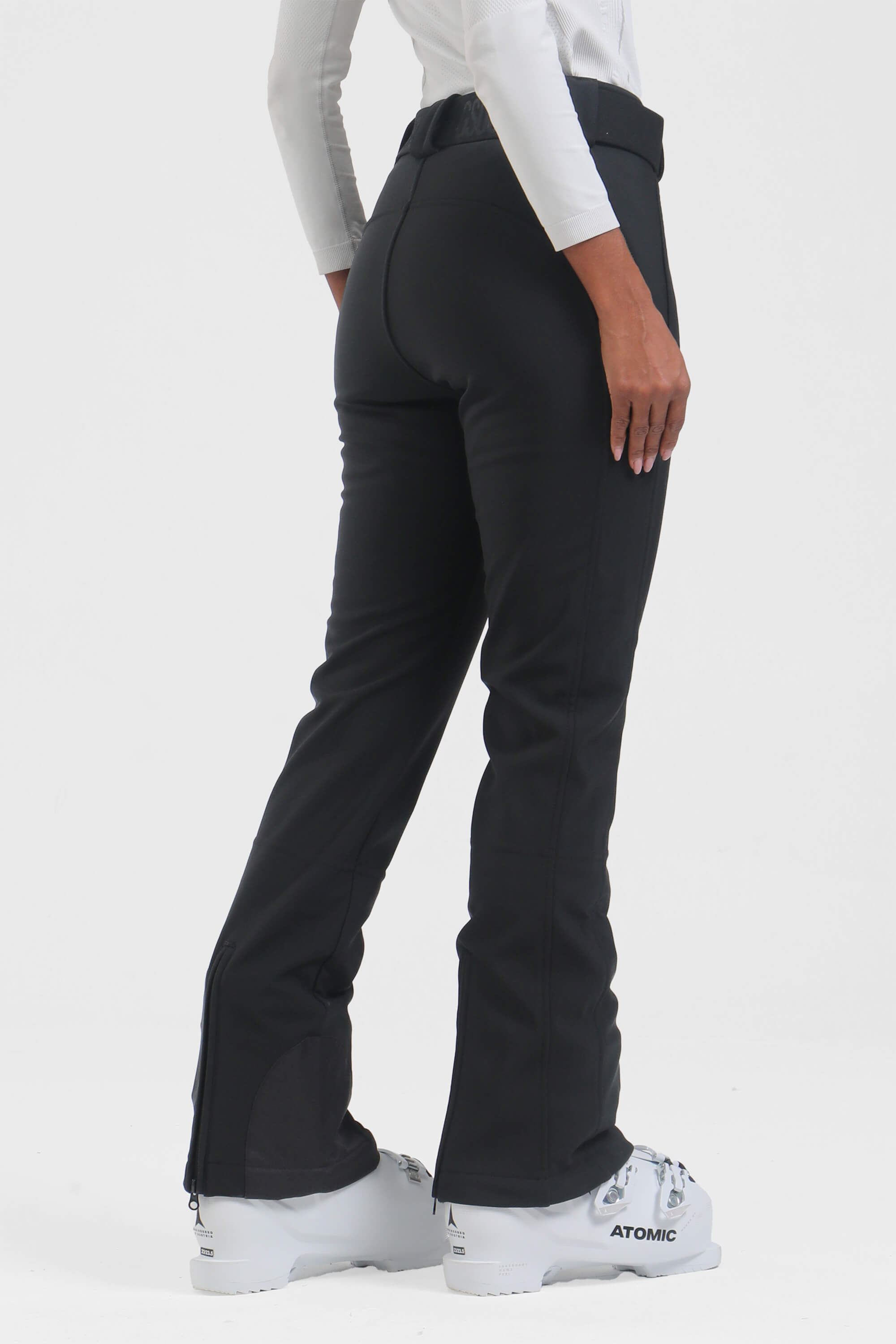 Black women's slim fit fleece-lined ski pants by Les Odettes, shown with a close-up of the waistband and fabric texture.