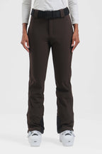 Black women's slim fit ski pants by Les Odettes, fleece-lined and wearable for winter skiing or snowboarding activities.