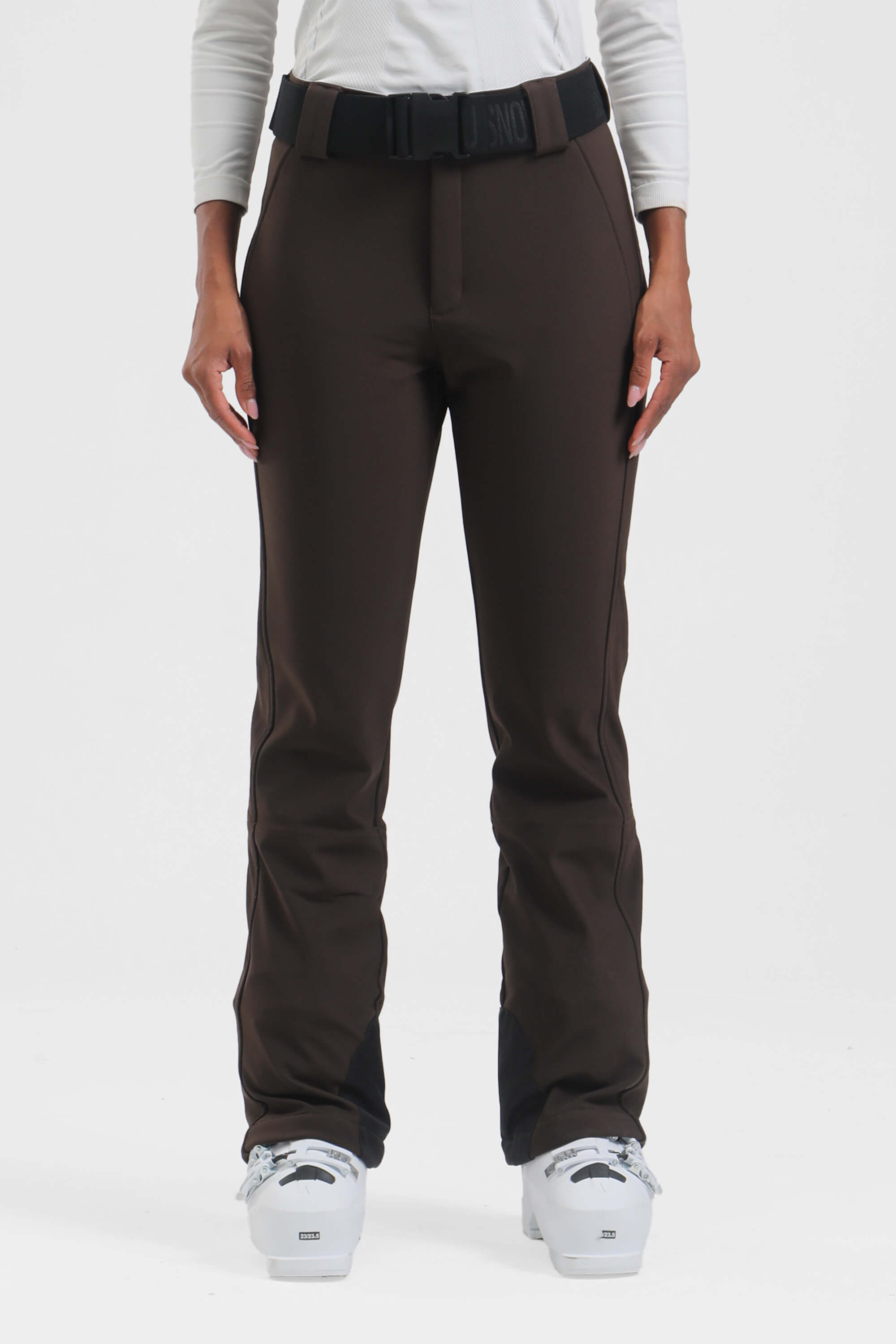 Black women's slim fit ski pants by Les Odettes, fleece-lined and wearable for winter skiing or snowboarding activities.
