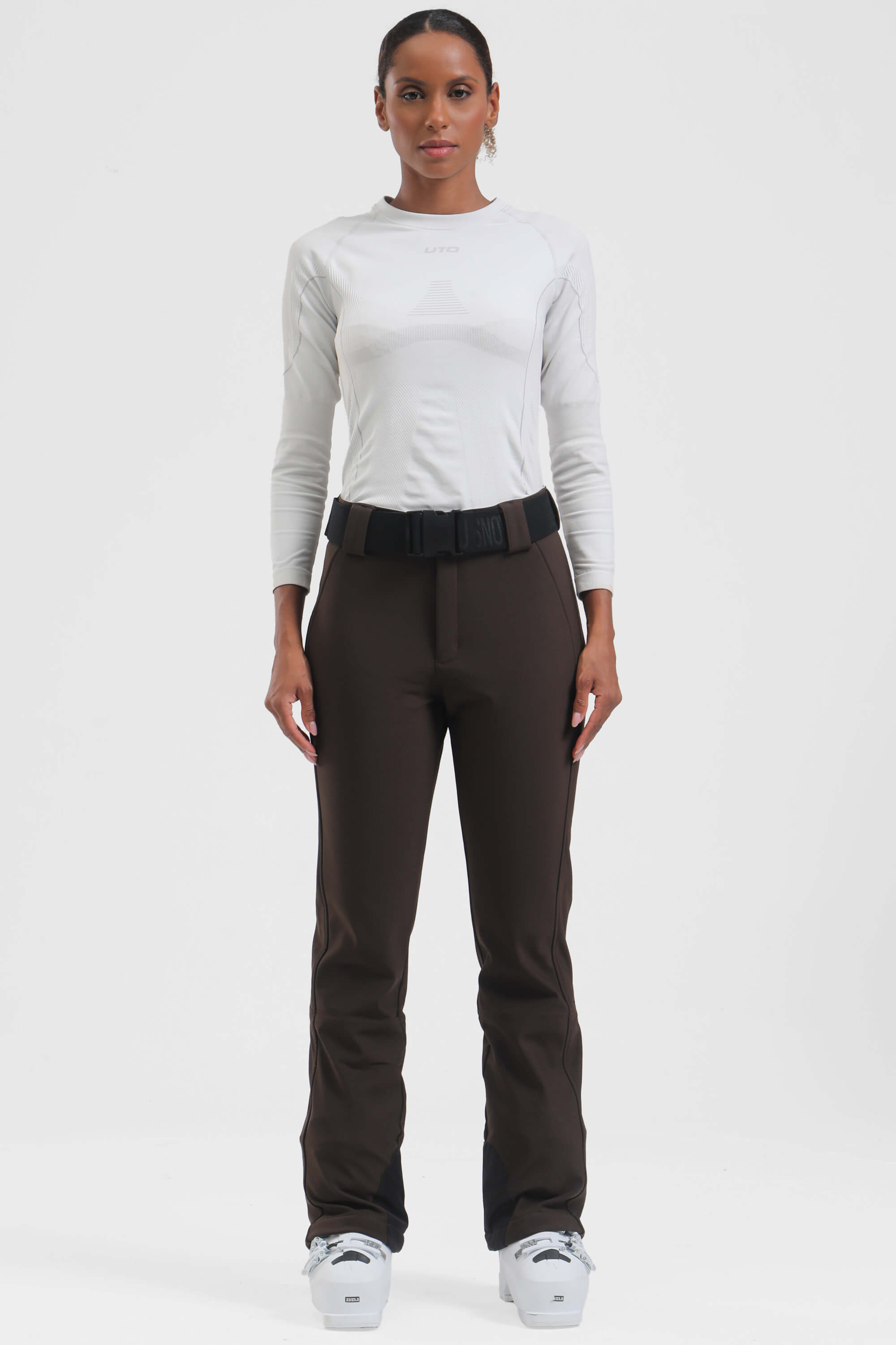 Women's black Les Odettes ski pants with slim fit, fleece-lined interior, designed for cold weather and active winter sports.