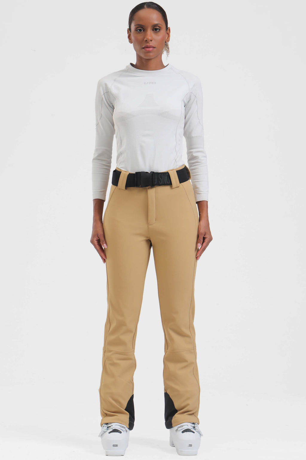 Black women's wearable slim fit ski pants with fleece lining by Les Odettes, designed for warmth and comfort on the slopes.