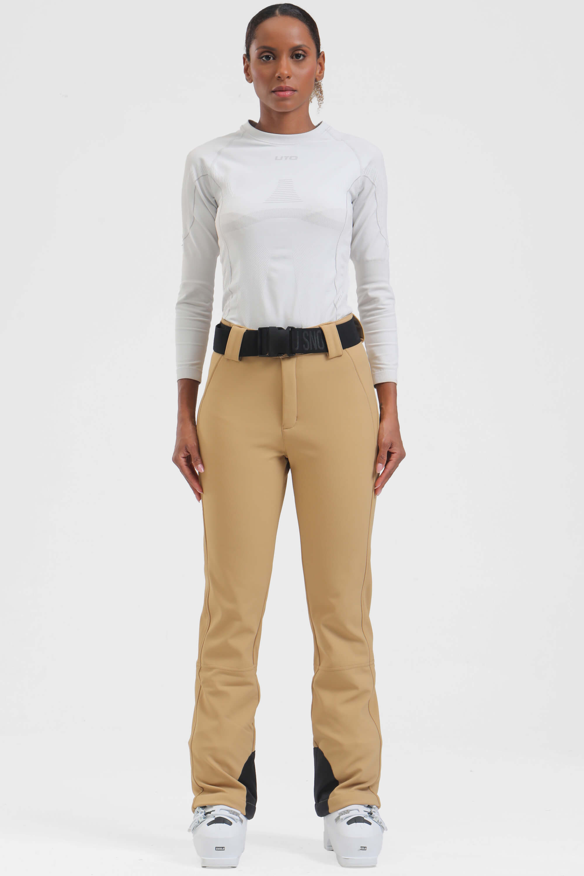 Black women's wearable slim fit ski pants with fleece lining by Les Odettes, designed for warmth and comfort on the slopes.