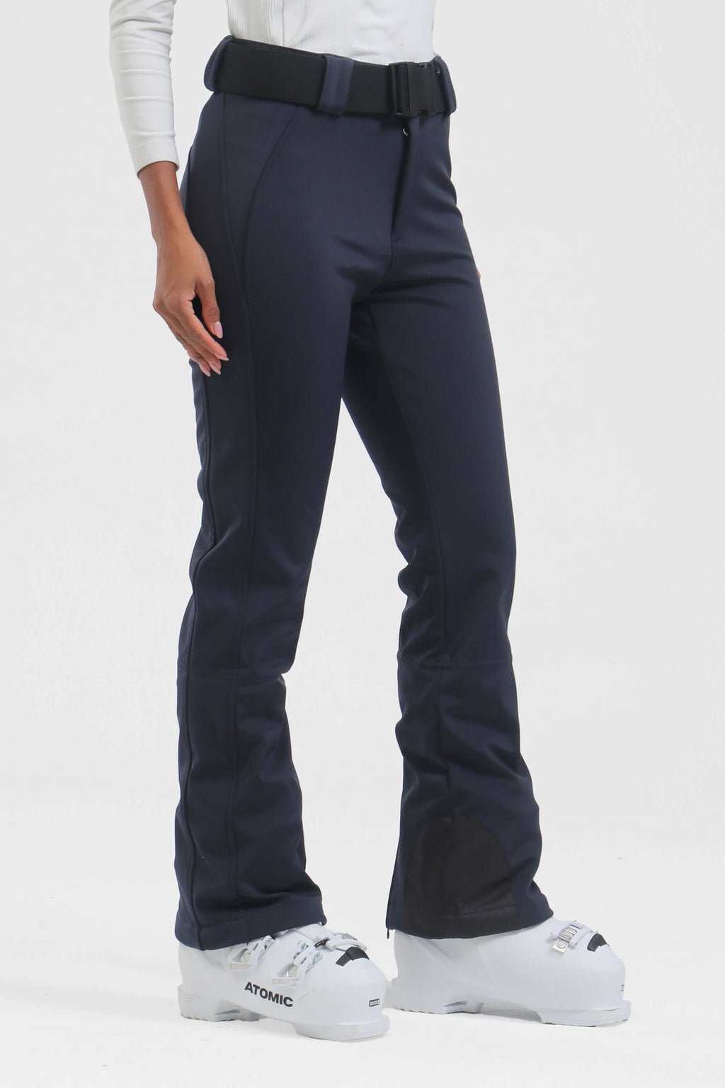 Black women's slim fit fleece-lined ski pants by Les Odettes, showing the fitted design and ski-specific fabric.