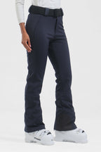 Black women's slim fit fleece-lined ski pants by Les Odettes, showing the fitted design and ski-specific fabric.